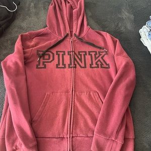 Pink sweater like a purple ish color